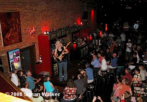 Laurie Morvan walks the bar in Champaign, Illinois, July 27, 2008